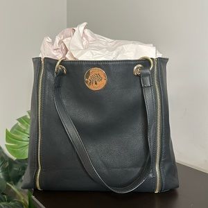 Black Bag with Zipper Features and Gold Tree Hardware